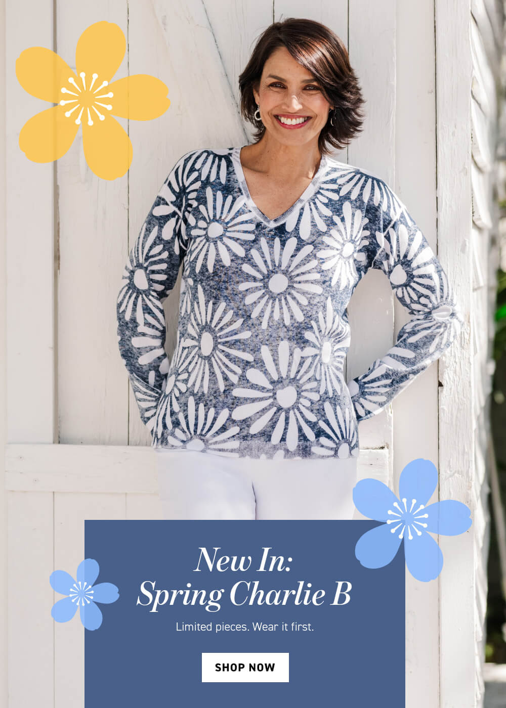 Woman wearing a blue floral long-sleeve top with promotional text overlay on a wooden background