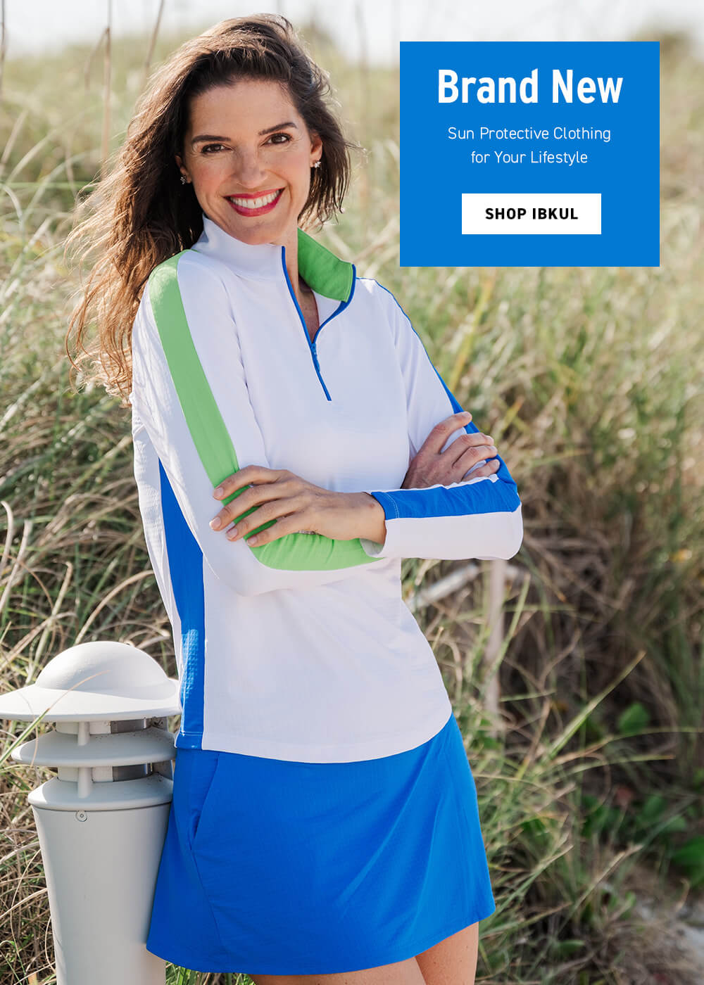 Woman wearing a colorful sun protective outfit with a brand new clothing promotion overlay.