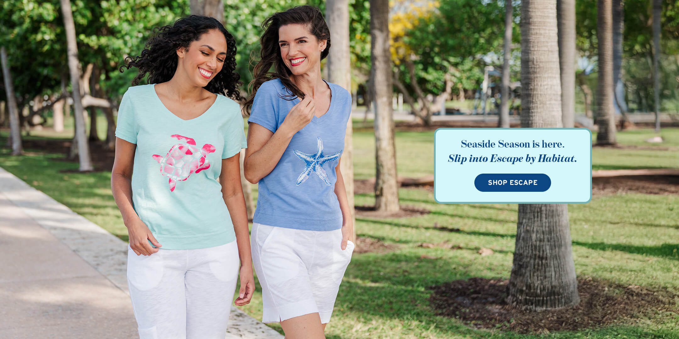 Two women walking outdoors with a promotional banner for 'Escape' clothing brand.