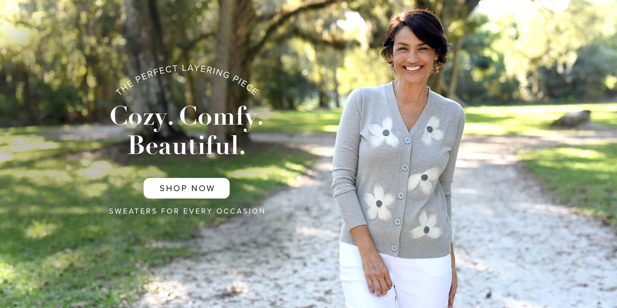 Woman wearing a grey sweater on a spring day