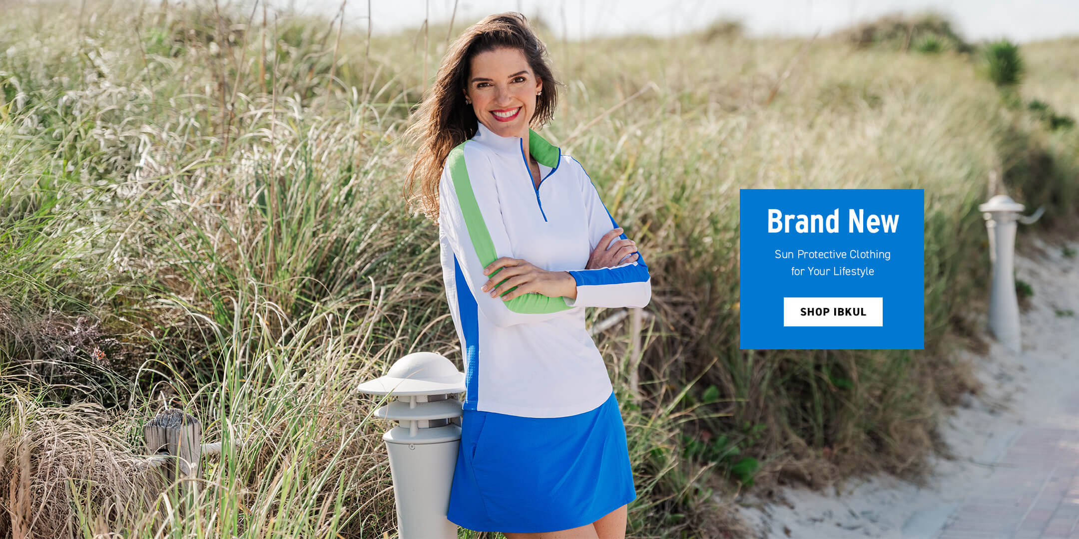 Woman in sun-protective clothing standing on a beach with promotional text overlay.