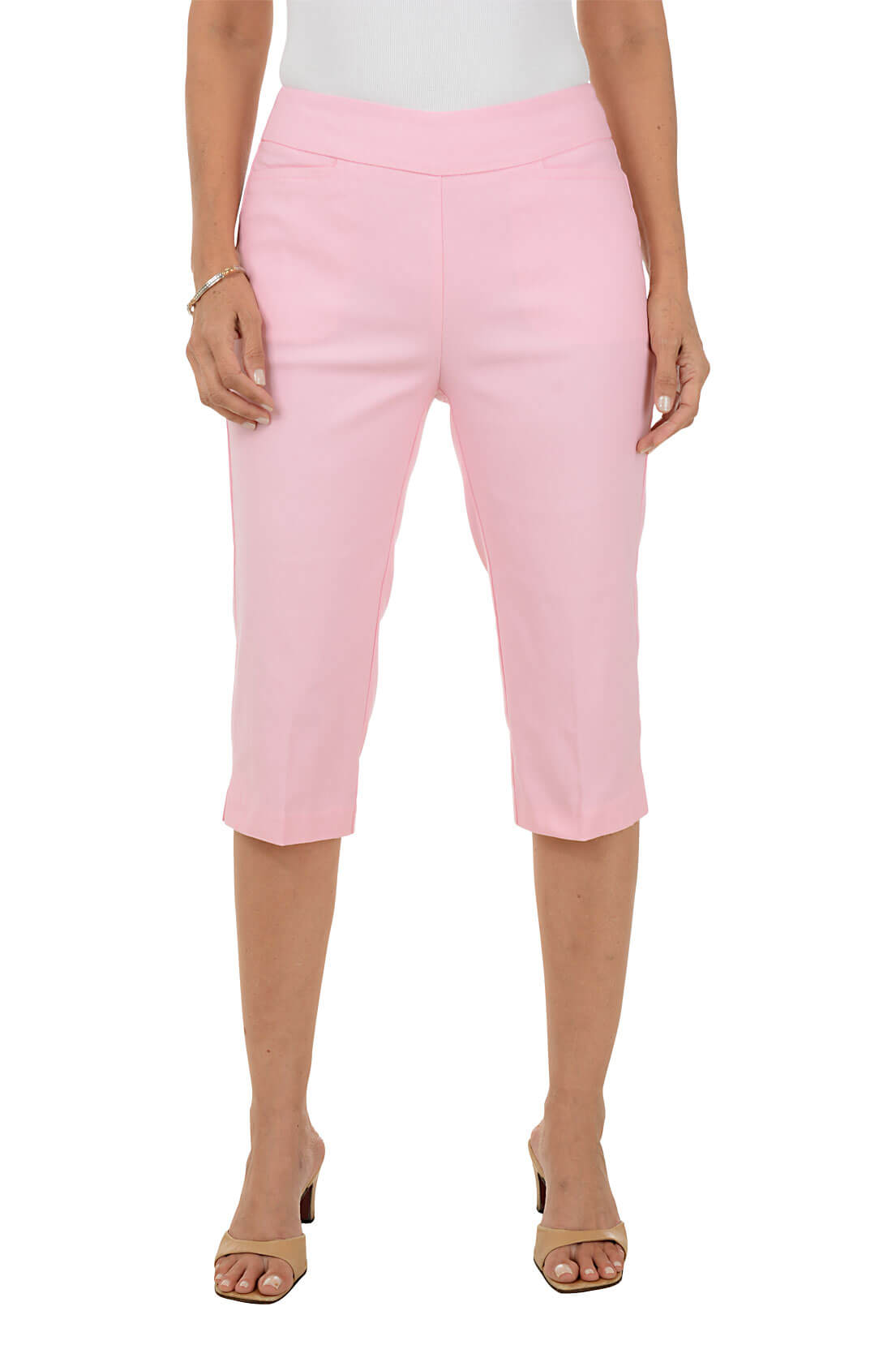 Person wearing pink clamdigger pants on a white background