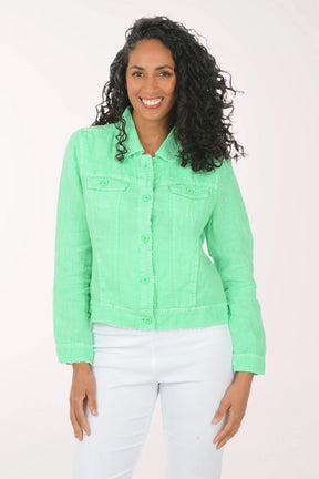 Woman wearing a light green denim jacket on a white background