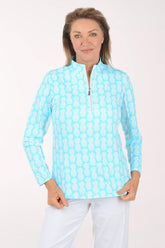 Woman wearing a light blue patterned shirt on a white background