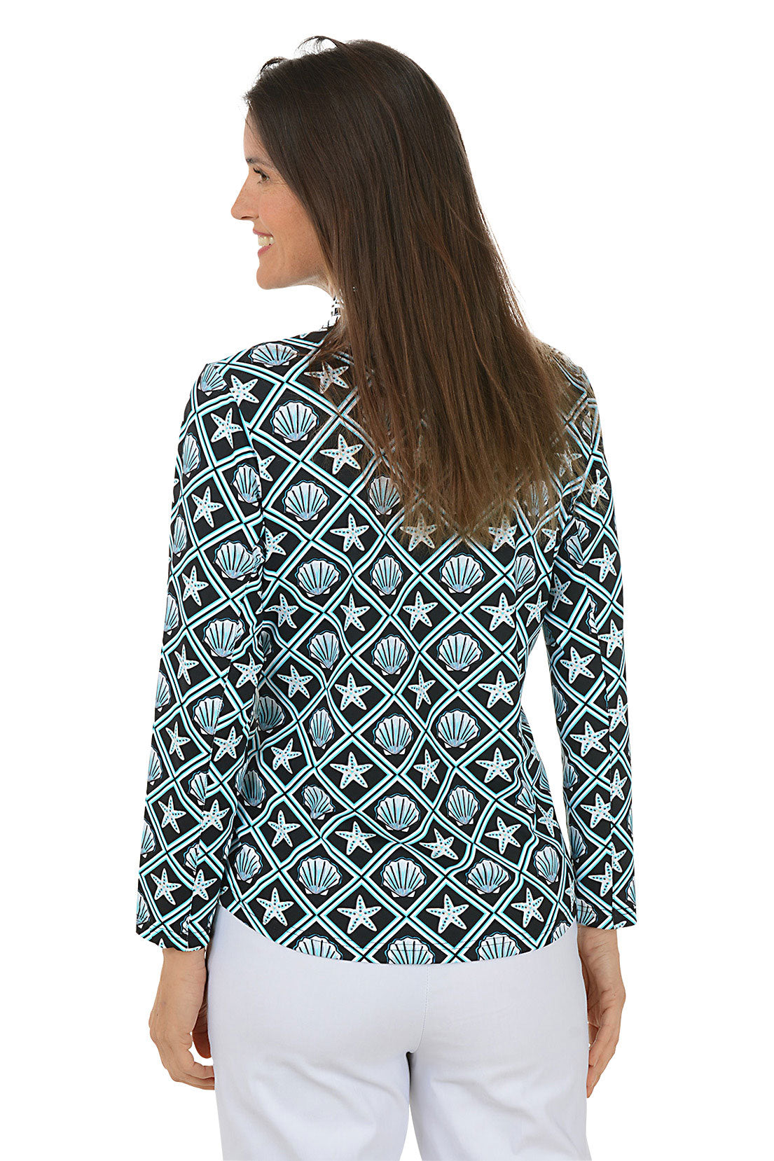 Woman wearing a patterned long-sleeve shirt with a white background. Back shot.