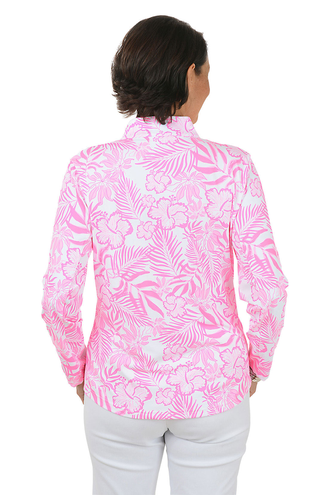 Woman wearing a pink floral patterned shirt with a white background. Back shot.