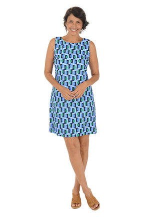 Woman wearing a sleeveless blue geometric patterned dress on a white background.