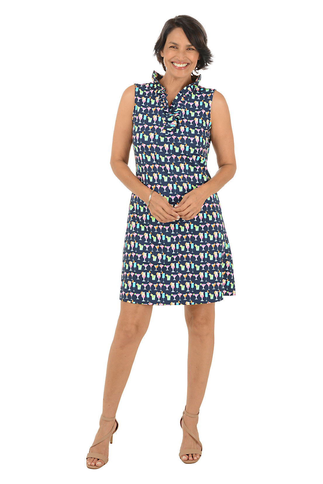 Woman wearing a patterned sleeveless dress on a white background.
