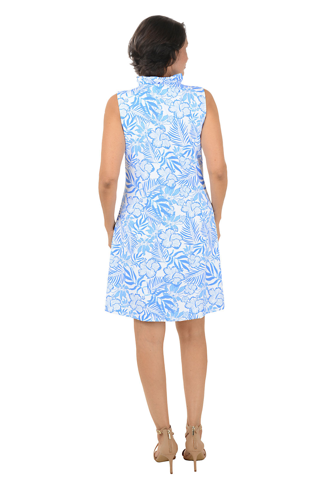 Woman wearing a blue floral dress on a white background. Back shot.
