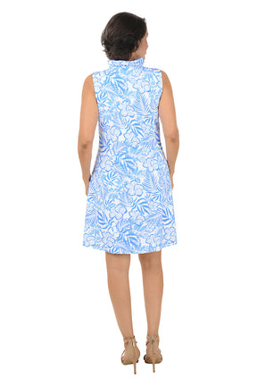 Woman wearing a blue floral dress on a white background. Back shot.