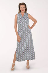 Woman wearing a sleeveless maxi dress with a black and white pattern on a white background.