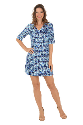 A woman wearing a blue multi 3/4 sleeve v-neck dress.