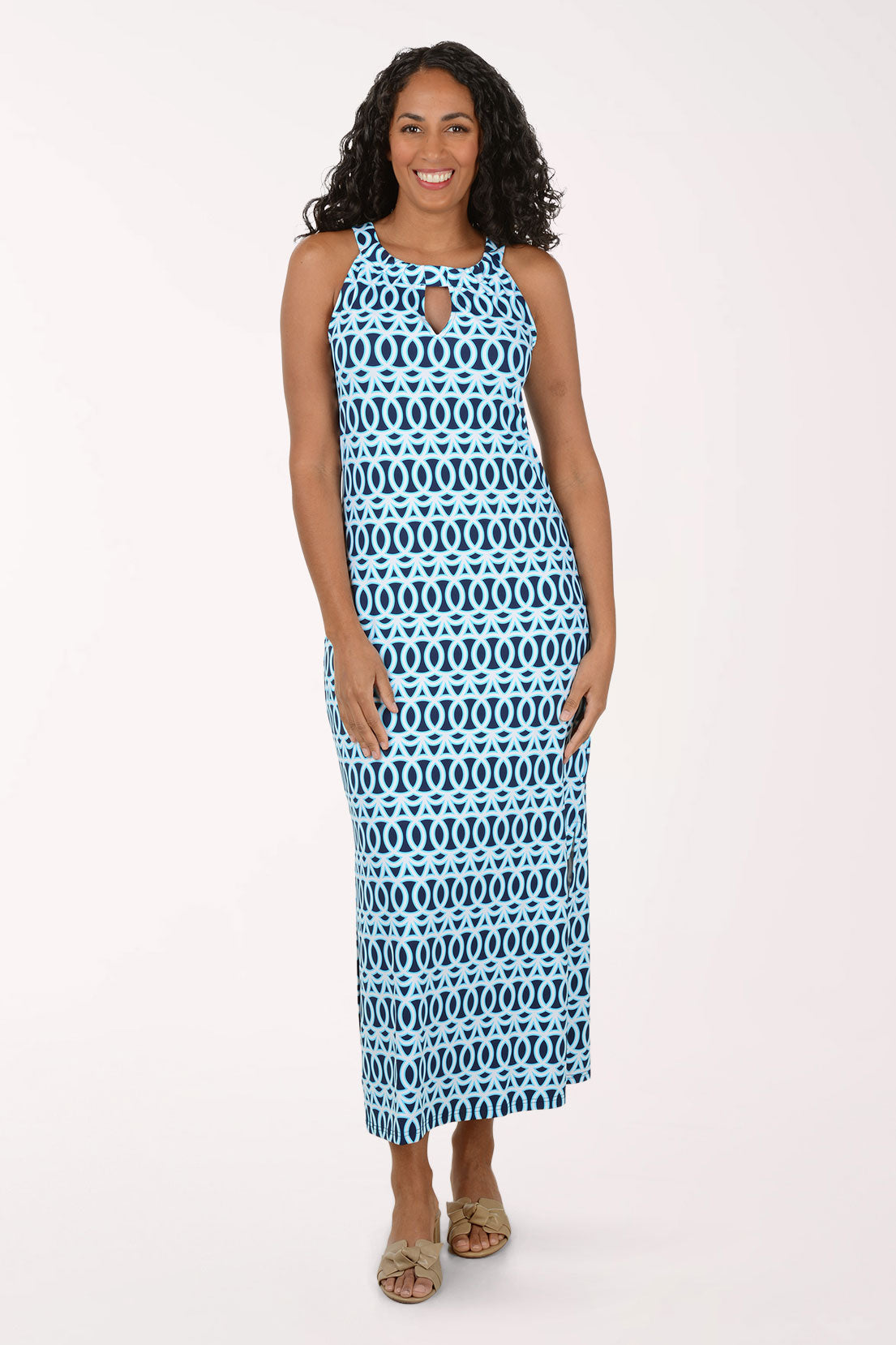 Woman wearing a blue and white patterned maxi dress on a white background.