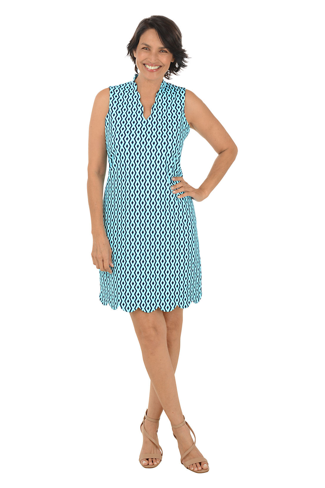 Woman wearing a blue patterned dress on a white background