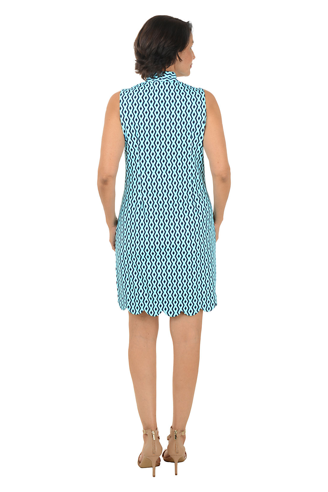 Woman wearing a blue patterned dress on a white background