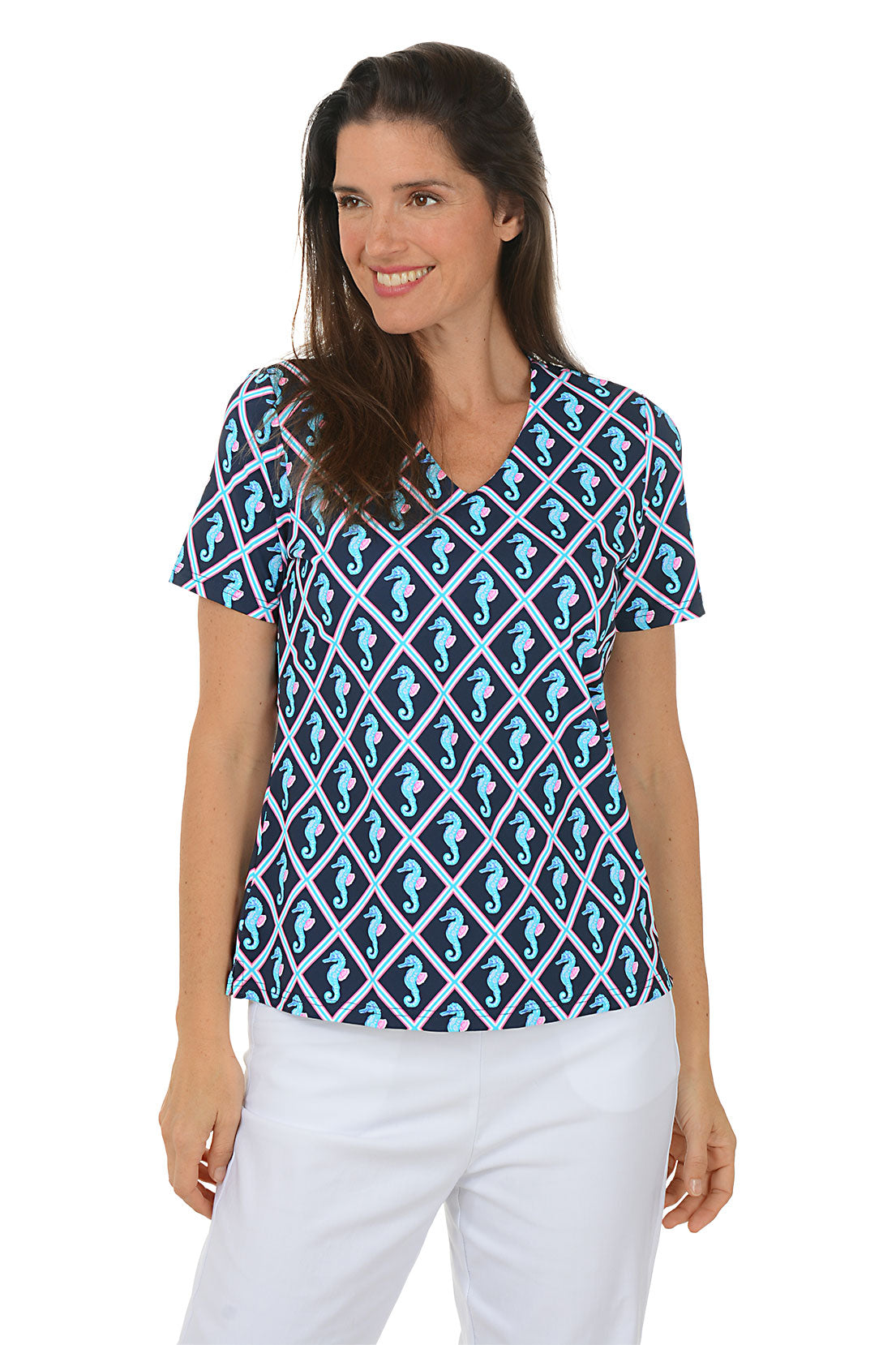 Woman wearing a blue and white patterned top with seahorses on a white background. Second front shot.