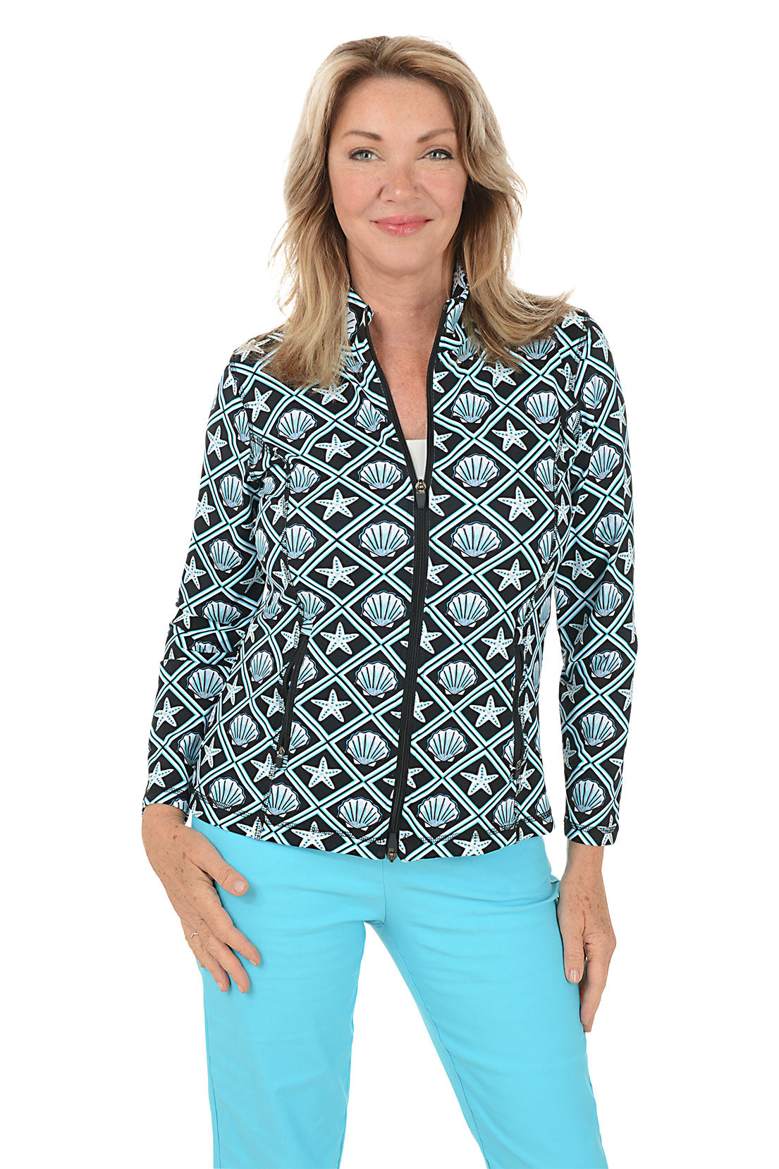 Woman wearing a patterned jacket with starfish and shell design on a white background. Second front shot.