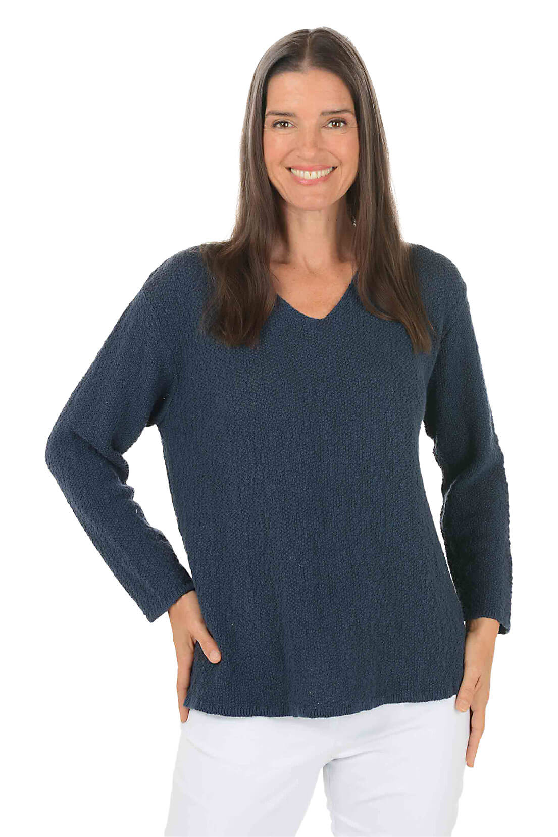 Woman wearing a navy blue sweater on a white background