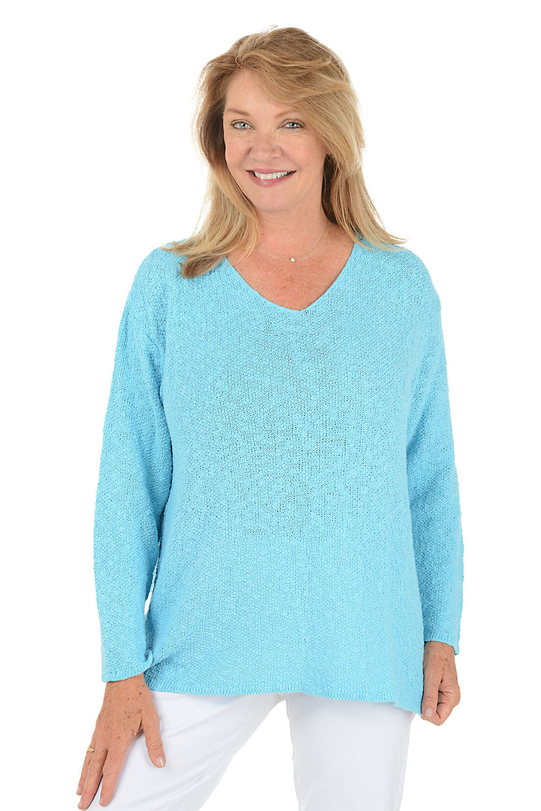 Woman wearing a light blue sweater on a white background