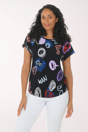Woman wearing a black t-shirt with colorful abstract designs on a white background