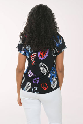 Woman wearing a black t-shirt with colorful abstract designs on a white background