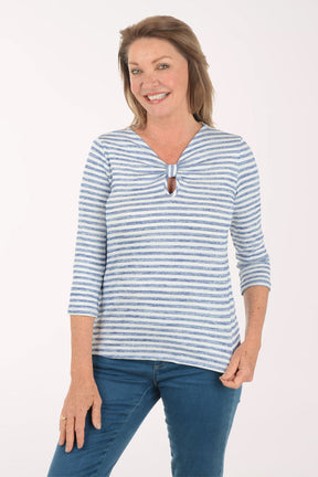 Woman wearing a blue and white striped shirt with a white background