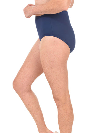 Person wearing navy blue high-waisted swimsuit on a white background