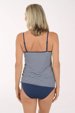 Woman wearing a blue and white striped tankini on a white background. Back shot.