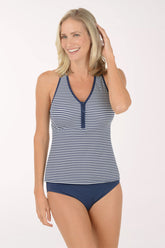Woman wearing a navy and white striped tankini set on a white background.