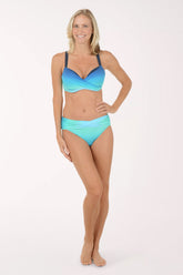 Woman wearing a blue and green bikini on a white background