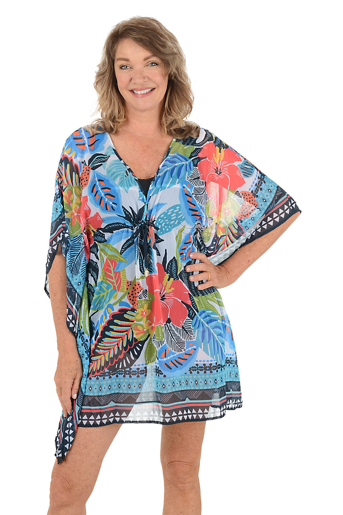 A woman wearing a multicolored floral pattern caftan.