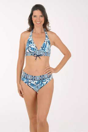 Woman wearing a blue and white patterned bikini on a white background. Full length shot.