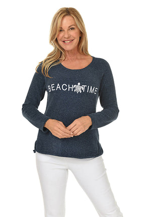 Woman wearing a navy blue sweatshirt with 'Beach Time' text and an eagle graphic on a white background