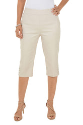Beige capri pants worn by a person on a white background.