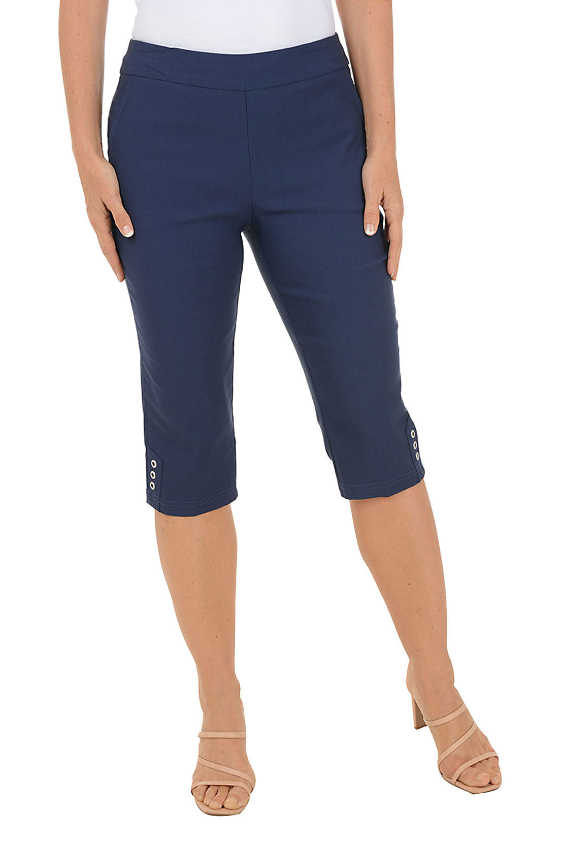 A woman wearing navy blue cropped capri pants.