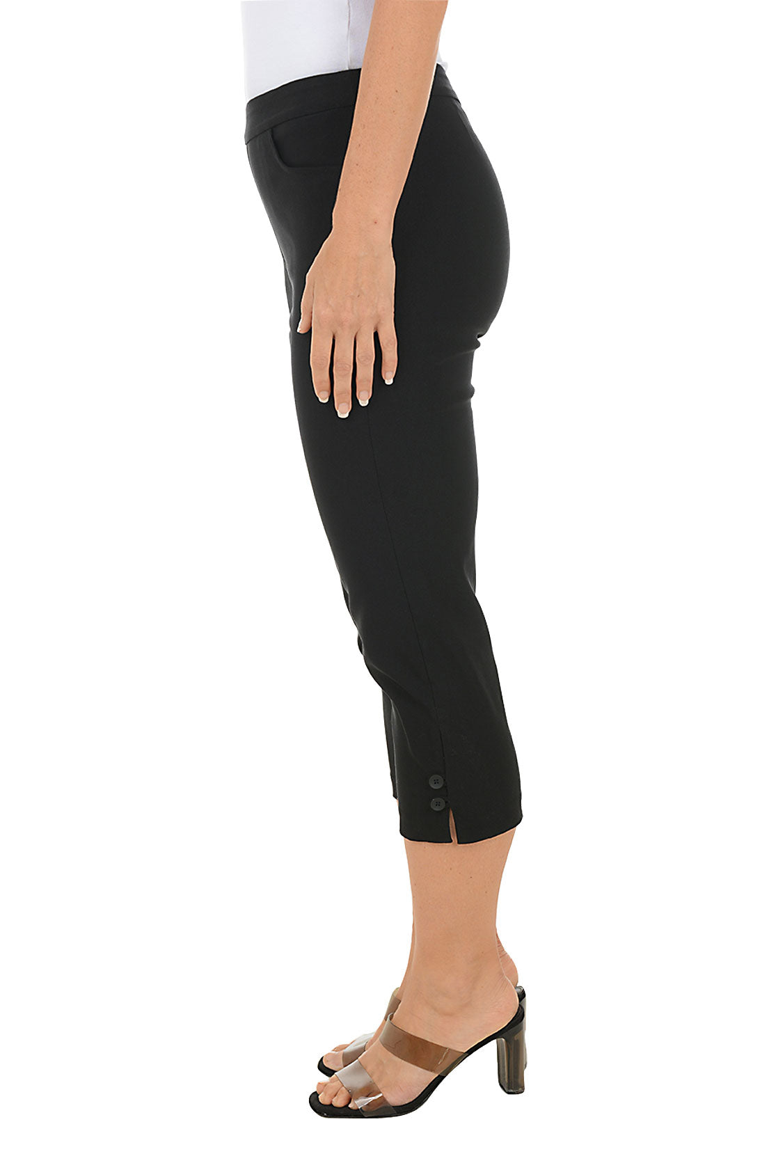 A woman wearing black capri pants. Side shot.