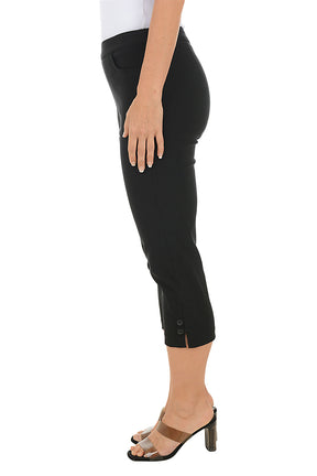 A woman wearing black capri pants. Side shot.