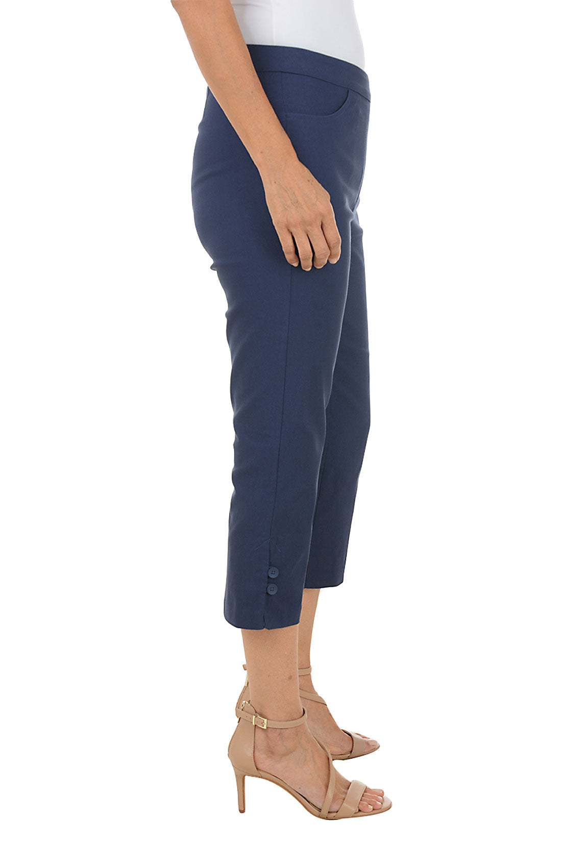 Navy blue capri pants worn by a person on a white background. Side shot.