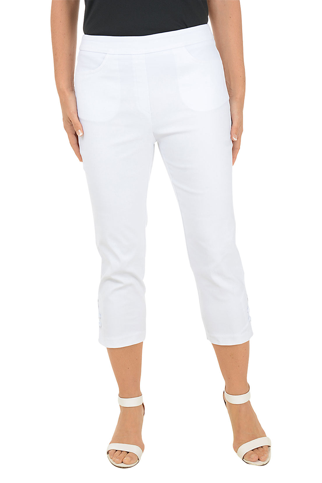 A woman wearing white capri pants.