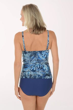 Woman wearing a blue floral tankini set on a white background. Back shot.