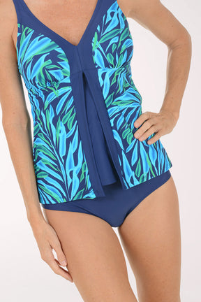 Blue and green leaf-patterned swimsuit on a white background
