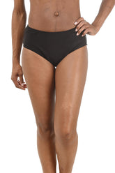 Person wearing black swim briefs on a white background.