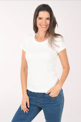 Woman wearing a white t-shirt and blue jeans on a white background