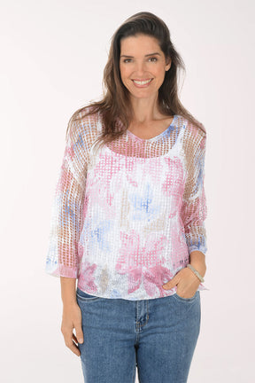 Woman wearing a floral blouse with a white background