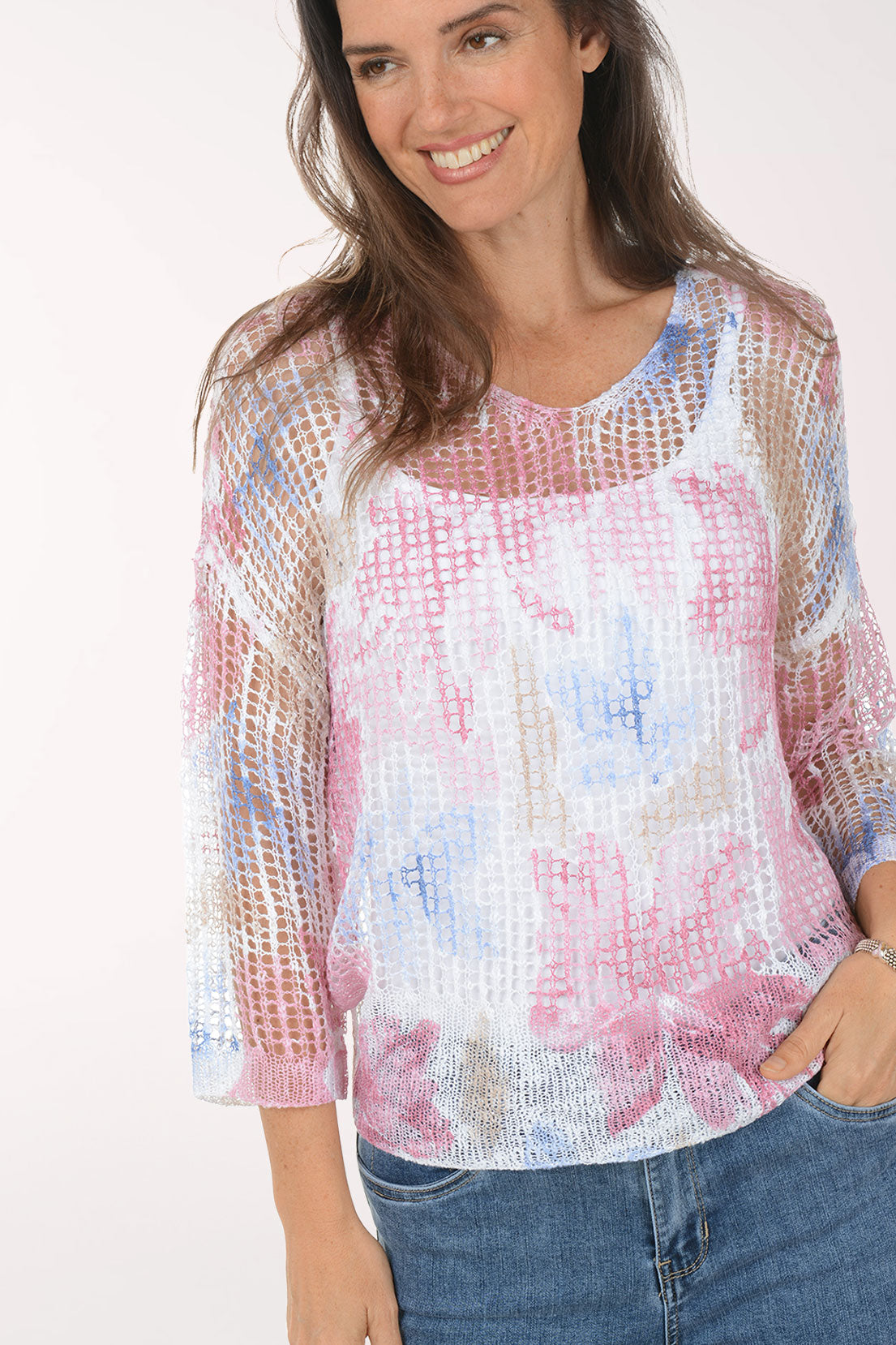 Woman wearing a floral blouse with a white background