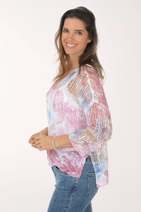 Woman wearing a floral blouse with a white background