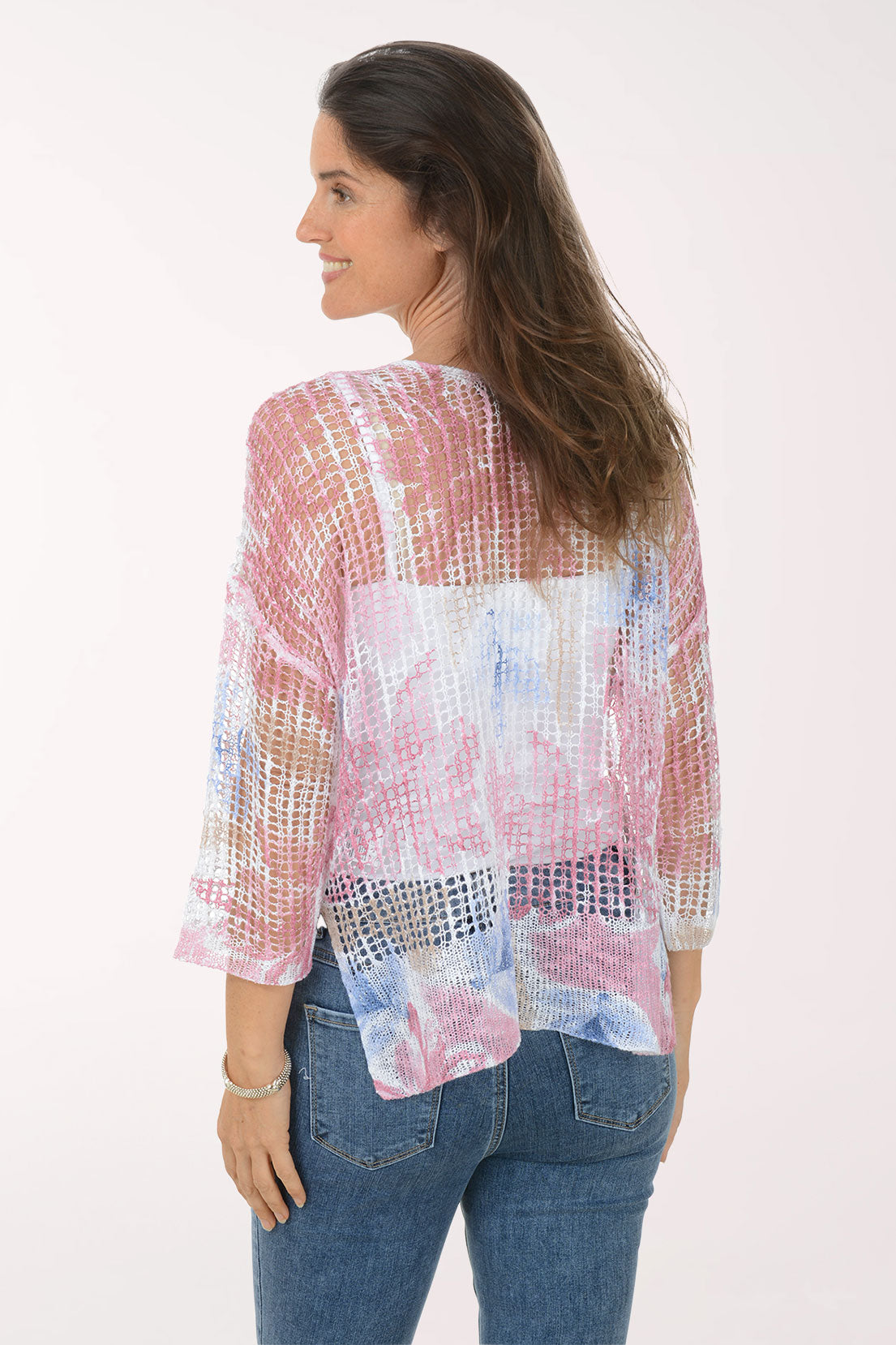 Woman wearing a floral blouse with a white background