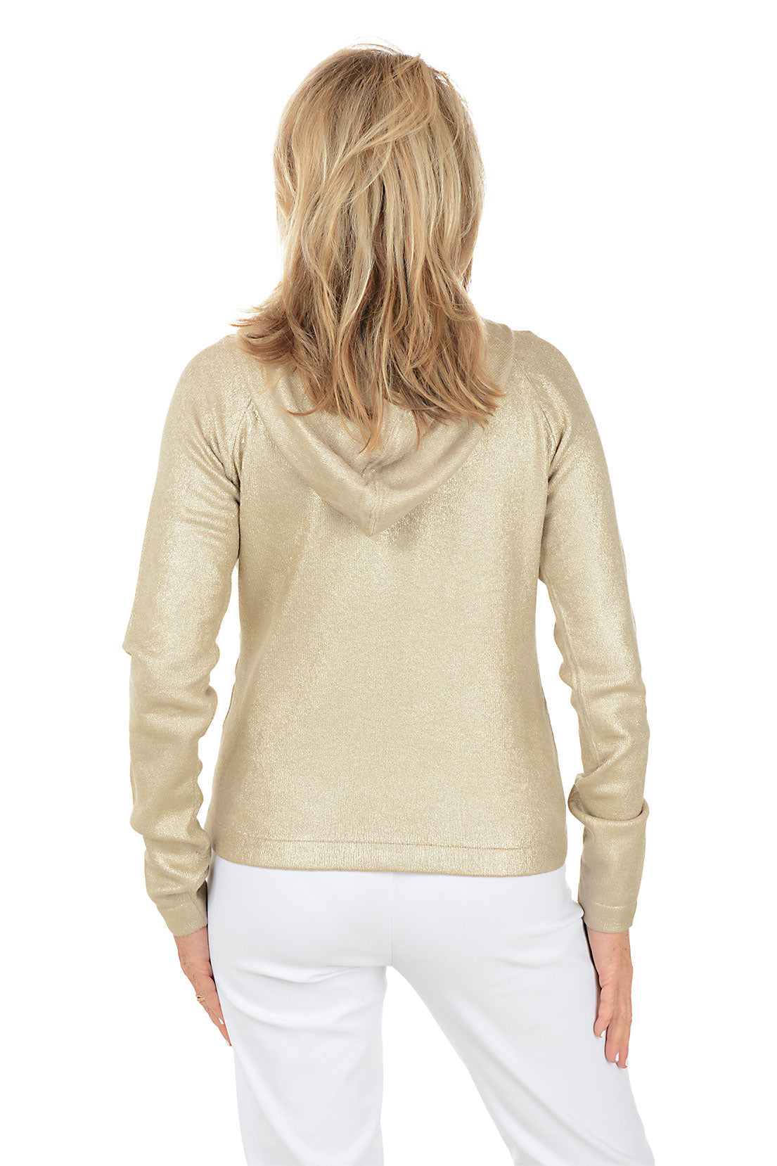 Woman wearing a gold hoodie and white pants on a white background. Back shot.