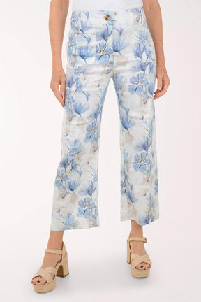 Floral-patterned pants worn by a person on a white background