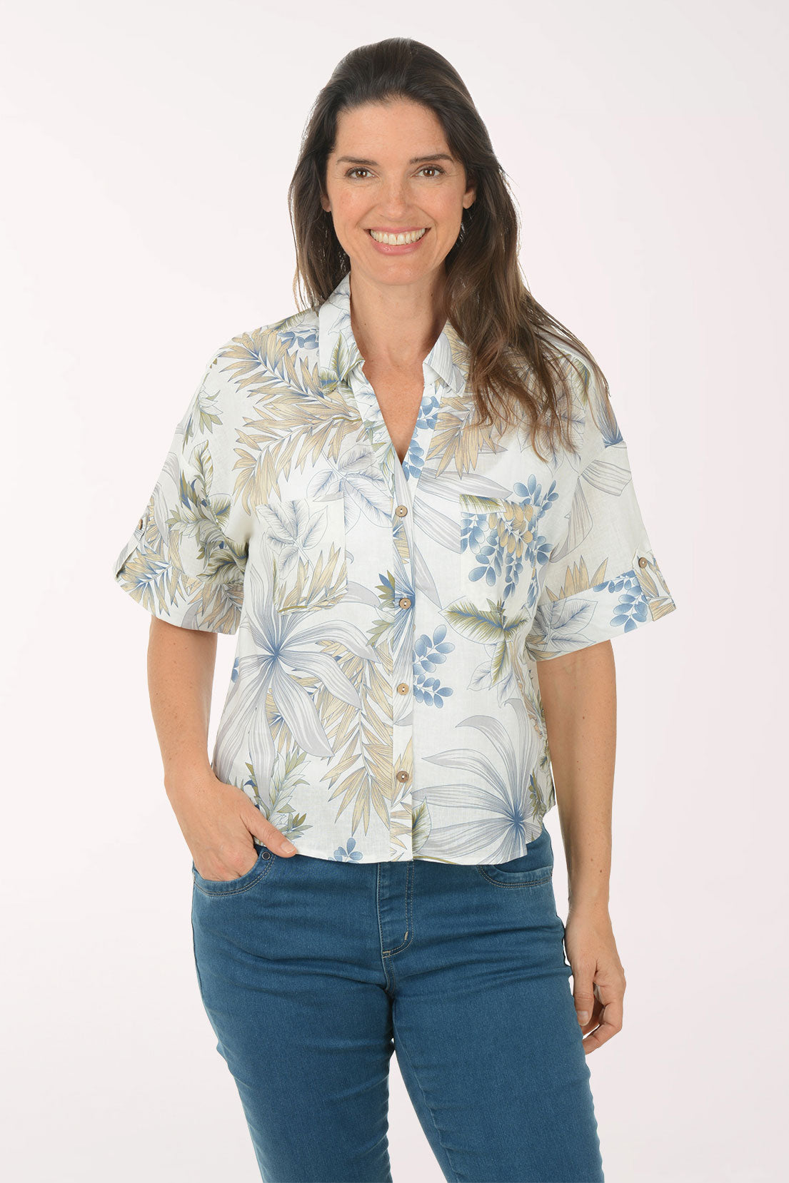 Woman wearing a floral shirt with a white background